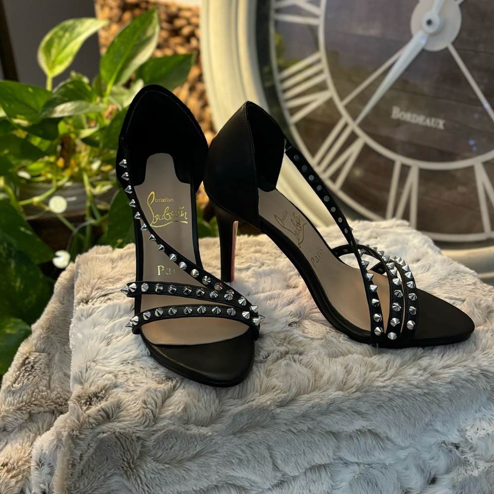 Christian Louboutin sandals/heels/pumps silver spiked ankle straps red soles